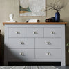 Modern grey bedroom dresser with 7 drawers and oak top, ideal for stylish and functional bedroom storage.