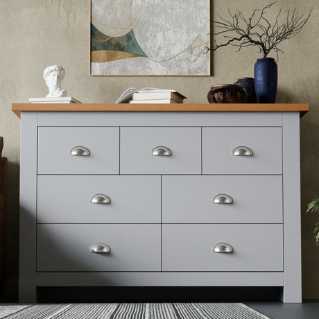 Modern grey bedroom dresser with 7 drawers and oak top, ideal for stylish and functional bedroom storage.