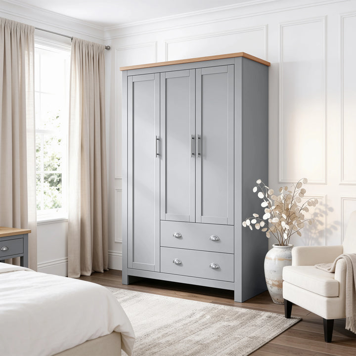 [Grey] Shaker grey triple wardrobe with two bottom drawers and an oak top in a modern bedroom setting.