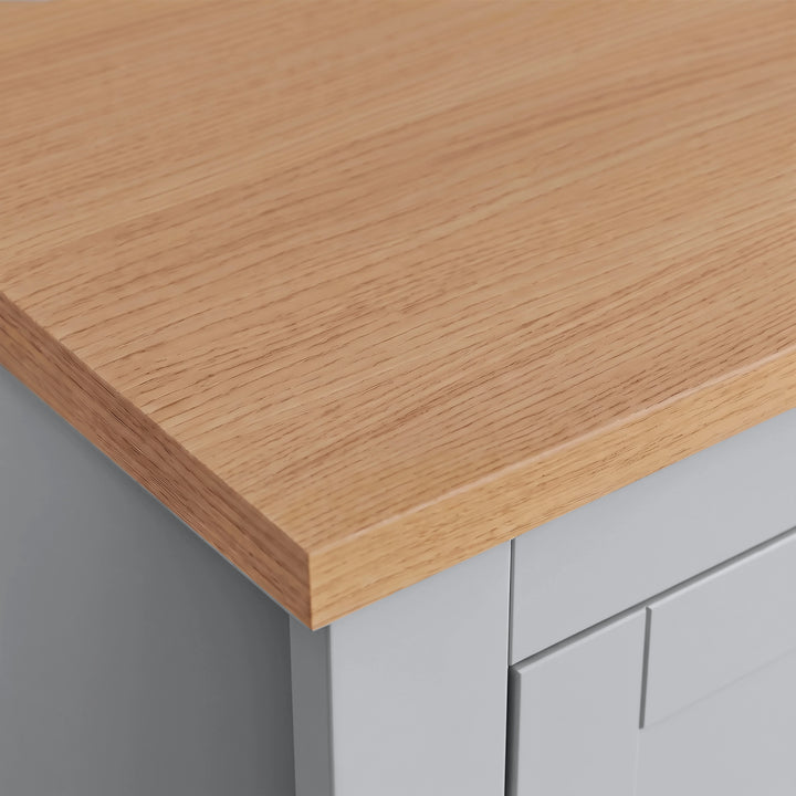 [Grey] Close-up view of the natural oak wood top and grey shaker cabinet finish on the triple wardrobe.