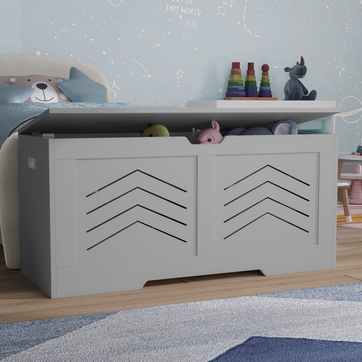 [Grey] Grey shaker toy box with lid open showing soft toys arranged inside next to teddy wall art