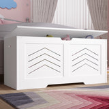 [White] Shaker toy box in white with chevron cutout panels and hinged lid in a kids bedroom by a rug