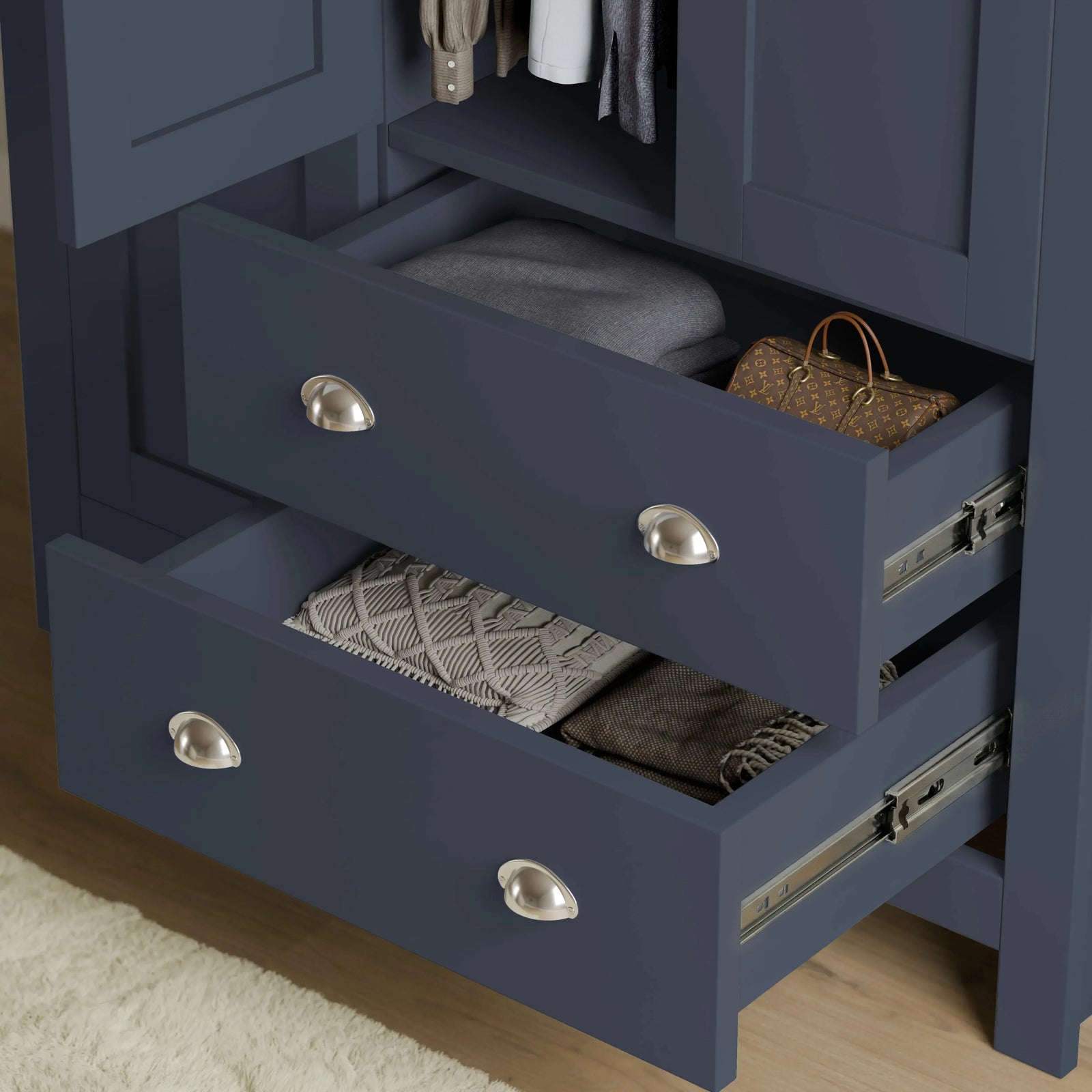 [Blue] Shaker triple wardrobe lower drawers extended, showing internal depth and silver cup drawer handles.