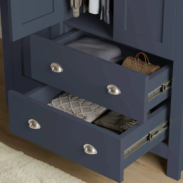 [Blue] Shaker triple wardrobe lower drawers extended, showing internal depth and silver cup drawer handles.