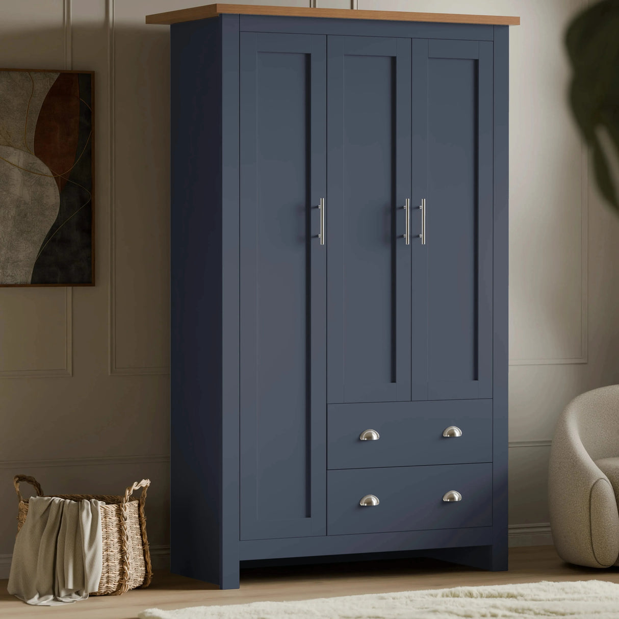 [Blue] Shaker triple wardrobe in navy blue with oak top, three panelled doors and two base drawers, angled view.