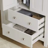 [White] White Shaker triple wardrobe lower drawers pulled out showing internal depth and folded clothes