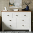 Large white bedroom dresser with 7 drawers and oak top, perfect for stylish bedroom storage and organisation.
