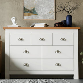 Large white bedroom dresser with 7 drawers and oak top, perfect for stylish bedroom storage and organisation.
