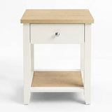 [White] Front view showing the bedside table with centered drawer, open lower shelf and oak-effect top