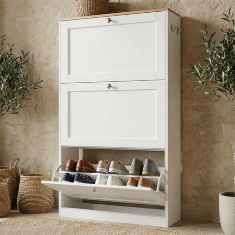 White shaker shoe cabinet in hallway with slim profile and three storage compartments placed against a wall