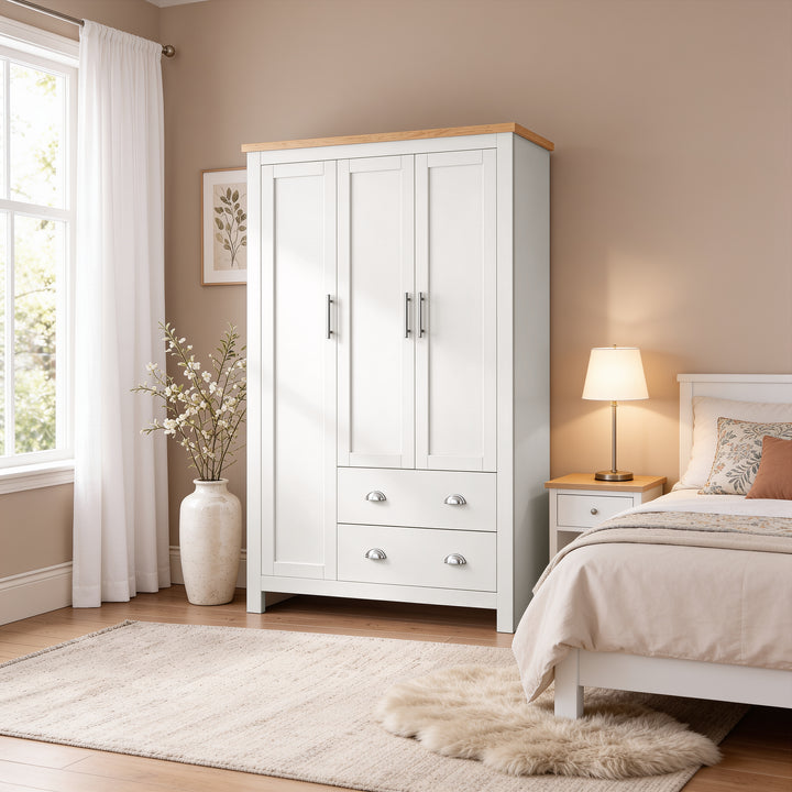 [White] Shaker White Triple Wardrobe styled in a cozy neutral bedroom alongside a matching bedside table.