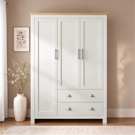 [White] Front view of the Shaker White Triple Wardrobe with Drawers and Shelves showing silver cup handles and bar pulls.