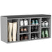 Gray shoe storage bench with various shoes on a white background