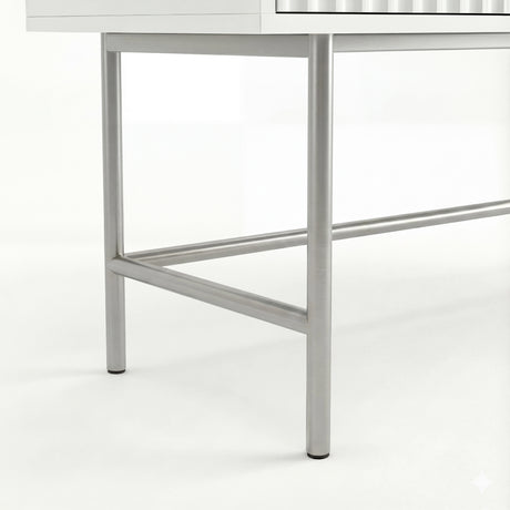 Close-up view of the silver metal legs and firm base of a contemporary white dressing table piece