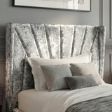 [Single | Silver] Close view of Sunrise wing headboard with pleated panels behind layered pillows