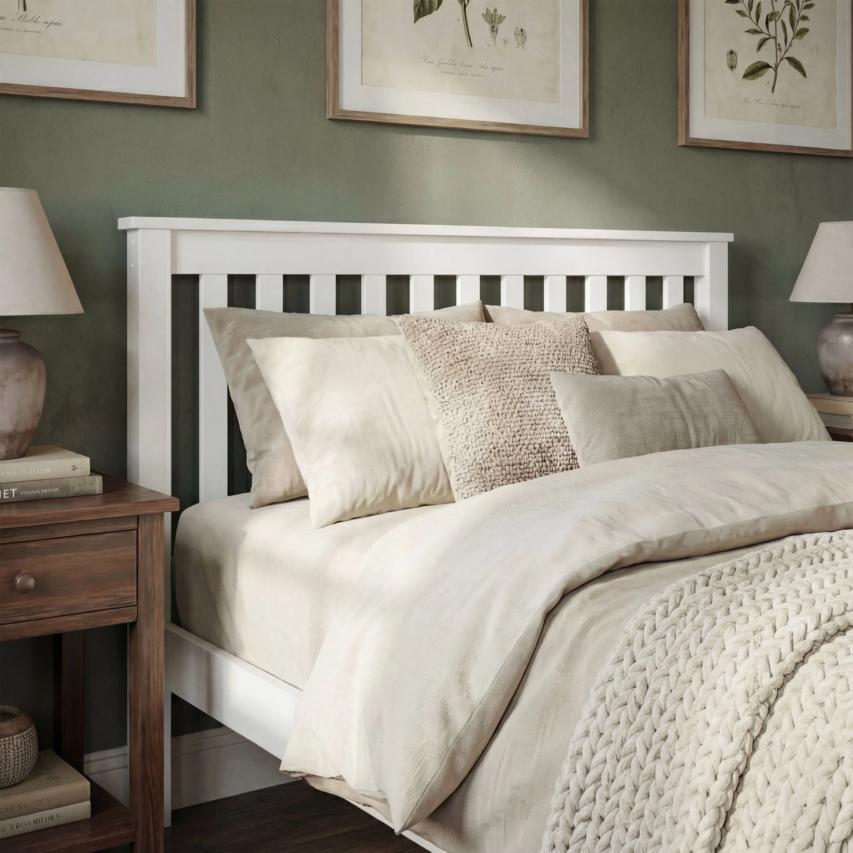 White single wooden bed frame with slatted headboard and cozy linens in a modern bedroom