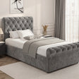 Single dark grey chesterfield ottoman bed with tufted and low footboard in modern bedroom setting