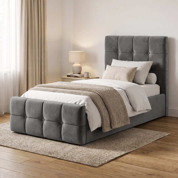 [Single | Dark Grey] Angled bedroom view with square panel headboard, padded footboard, white bedding, lamp, curtain, and rug