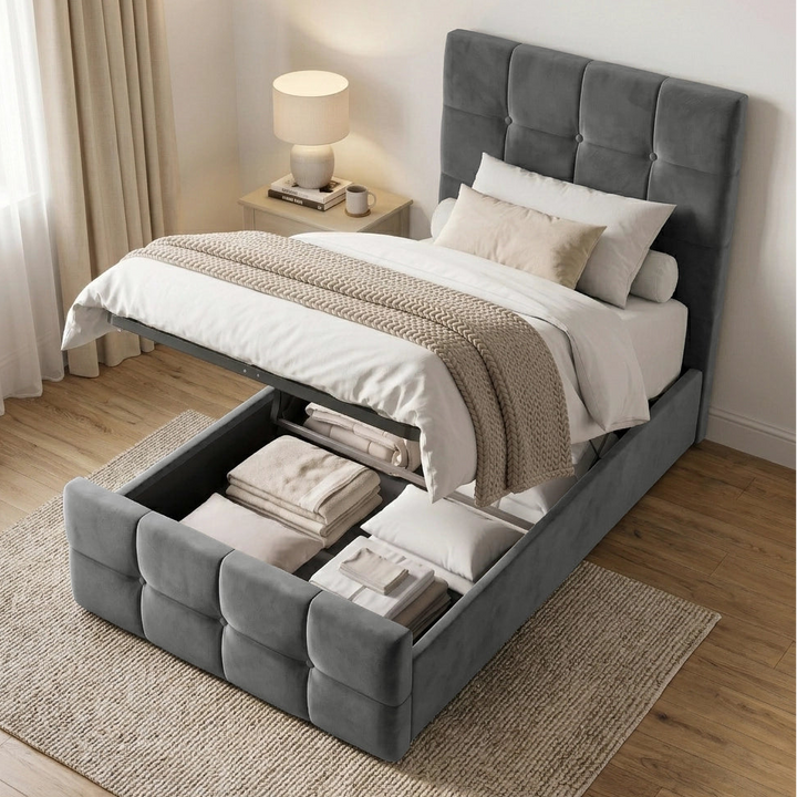 [Single | Dark Grey] Ottoman storage view with raised mattress base, black lift frame, folded bedding, pillows, and curtains
