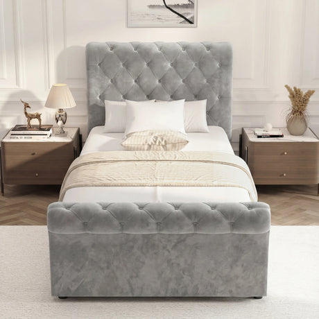 Front elevation of single grey upholstered storage bed with cushioned frame and low footboard