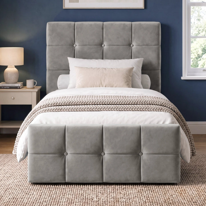 [Single | Grey] Straight front bedroom view with square panel headboard, padded footboard, knitted throw, lamp, and window