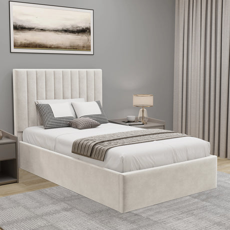 Neatly made bed with decorative pillows and a lamp in a bedroom setting.