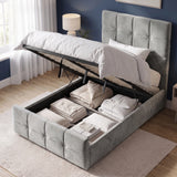 [Single | Grey] tufted storage bed frame with the mattress lifted open to show the raised platform and stored bedding, set in a styled bedroom with blue walls, a window, curtains, and a bedside lamp.