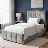 [Single | Grey] tufted velvet bed frame with a tall matching headboard and footboard, styled in a modern bedroom with white nightstands, beige curtains, and wall sconces.