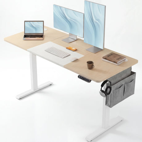 Modern Pine Electric Standing Desk setup with dual monitors, laptop, and accessories. Includes side storage pocket and headphone hook for organization.