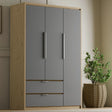 [Grey] Three door Skova wardrobe front-angle, panel fronts over oak carcass with two lower drawers