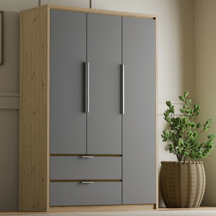 [Grey] Three door Skova wardrobe front-angle, panel fronts over oak carcass with two lower drawers