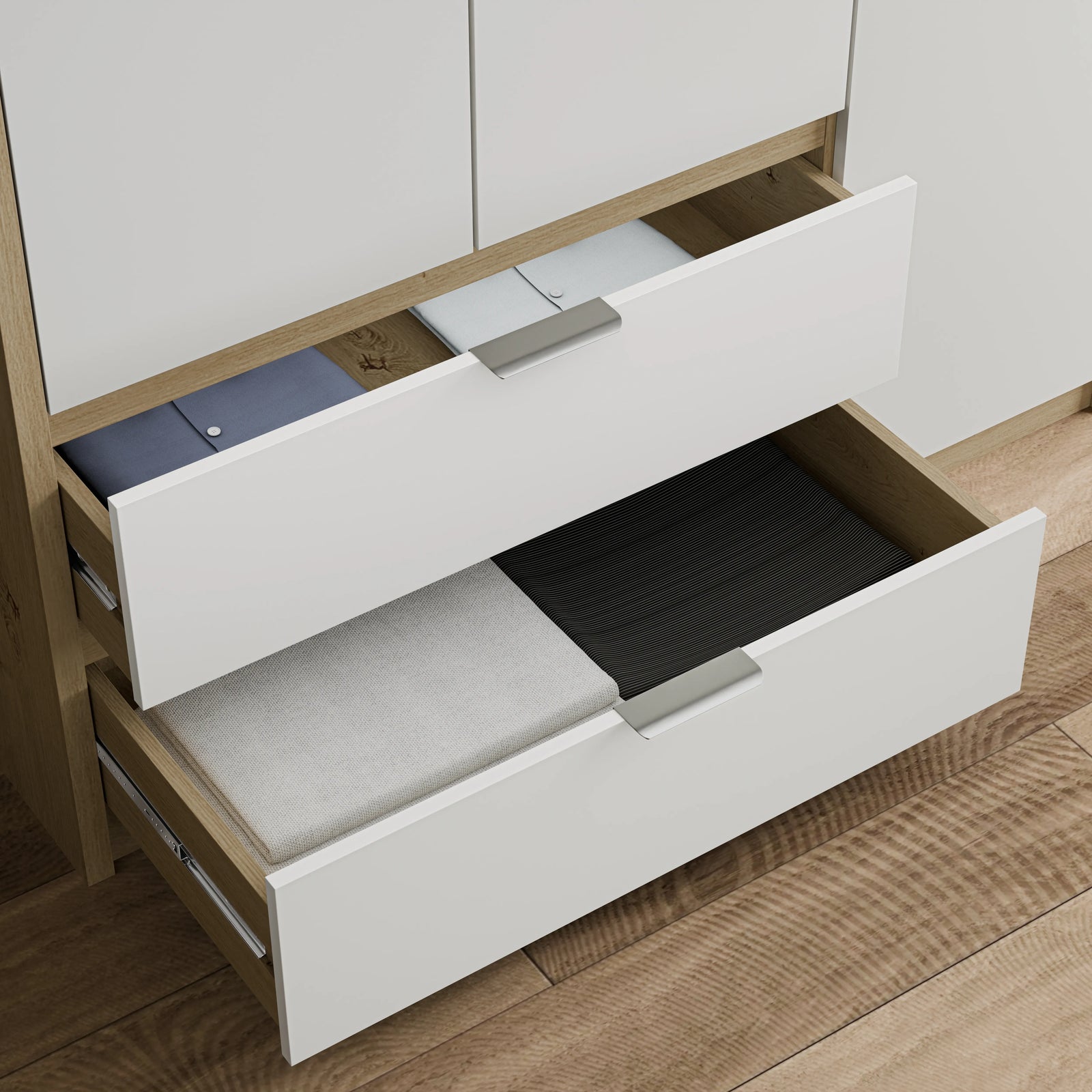 [White] Two internal drawers of Skova 3 door wardrobe pulled open showing oak base and metal handles