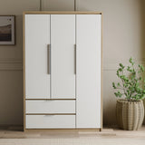 [White] Straight-on Skova 3 door wardrobe showing symmetrical panelled doors above two drawers