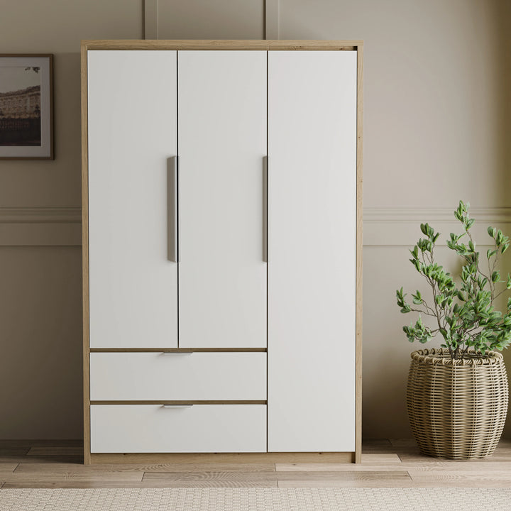 [White] Straight-on Skova 3 door wardrobe showing symmetrical panelled doors above two drawers