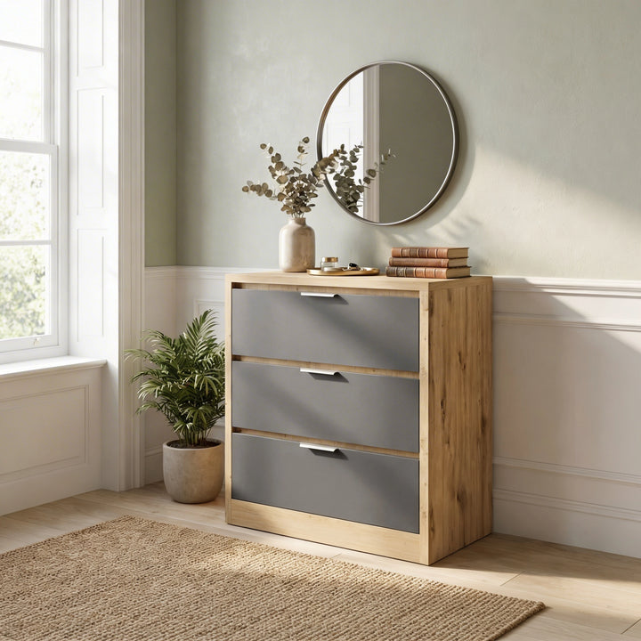 [Oak+Grey] Bedroom shot of Skova chest of drawers showing oak frame around three matte grey drawers