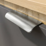 [Oak+Grey] Close-up of brushed metal cup handle on grey drawer of Skova chest of drawers against oak frame
