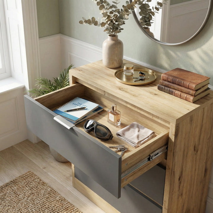 [Oak+Grey] Looking down into open top drawer of Skova chest of drawers, contents visible on grey base