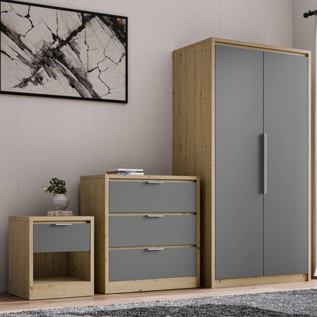 [Oak+Grey] Three piece bundle of oak-frame wardrobe, grey 3 drawer chest and grey bedside table styled along a panelled wall