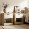 [Oak+White] Skova bedside pair in oak with white drawer fronts, vase and books on top, beside a bed in a neutral room
