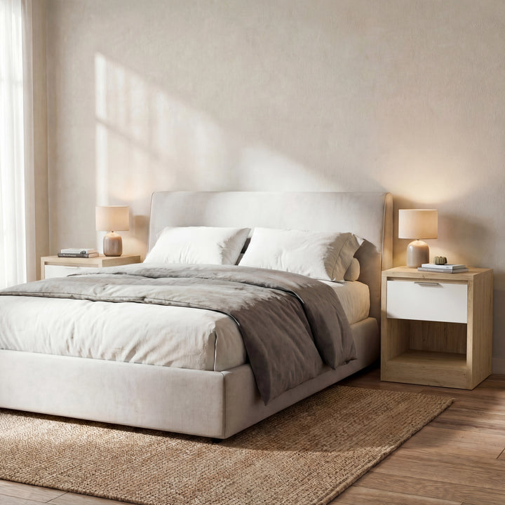 [Oak+White] Bedroom scene with Skova bedside pair in oak and white either side of a beige fabric bed frame