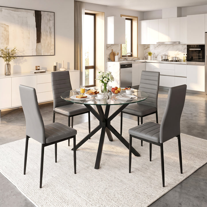 [Grey] Skyra Round Glass Dining Table and 4 Grey Chairs Set styled in a bright modern open-plan kitchen and dining area.