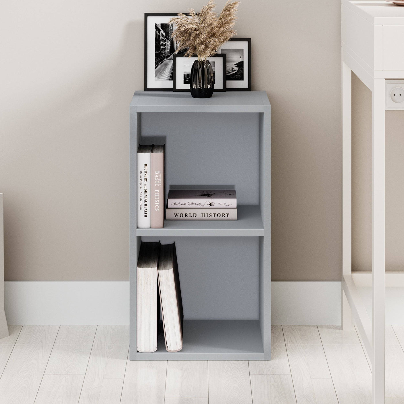 Grey Blisswood 2 shelf bookcase placed in a modern home office, compact and functional design.