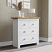 Slim white chest of drawers with flower pot on top stylish compact storage for modern spaces