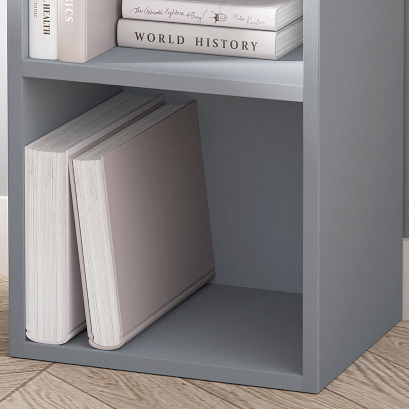 Close-up of bottom shelf on grey Blisswood bookcase, styled with large books and clean lines.