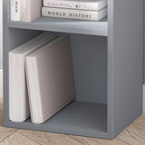 Close-up of bottom shelf on grey Blisswood bookcase, styled with large books and clean lines.