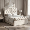 [Small Double | Beige] Angled bedroom view with tufted headboard, rolled footboard, white bedding, side tables, and wall art