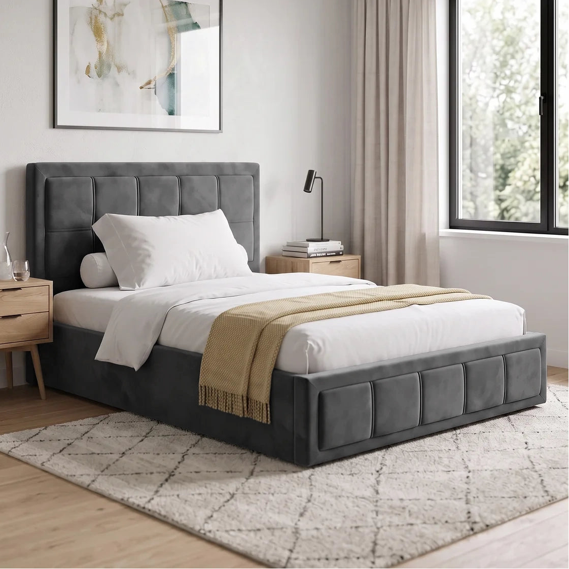 [Small Double | Grey] A modern gray upholstered bed with a tufted headboard and matching footboard, styled in a bright bedroom with white bedding, a beige throw blanket, light wood nightstands, and a patterned rug.