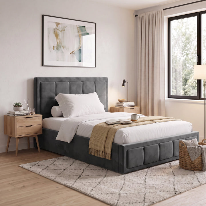 [Small Double | Grey] modern bedroom scene featuring a grey tufted upholstered bed frame with white bedding, a beige throw blanket, a light wood nightstand, and a patterned rug in a bright, neutral-toned room.
