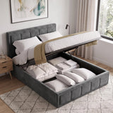 [Small Double | Grey] upholstered lift-up storage bed in a bright bedroom, shown open with white bedding and folded linens stored underneath. The bed is placed on a light rug beside a wooden nightstand and window.