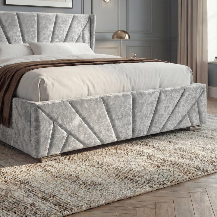 [Small Double | Silver] Footboard detail showing pleated velvet panels, white bedding, brown throw, and metal feet